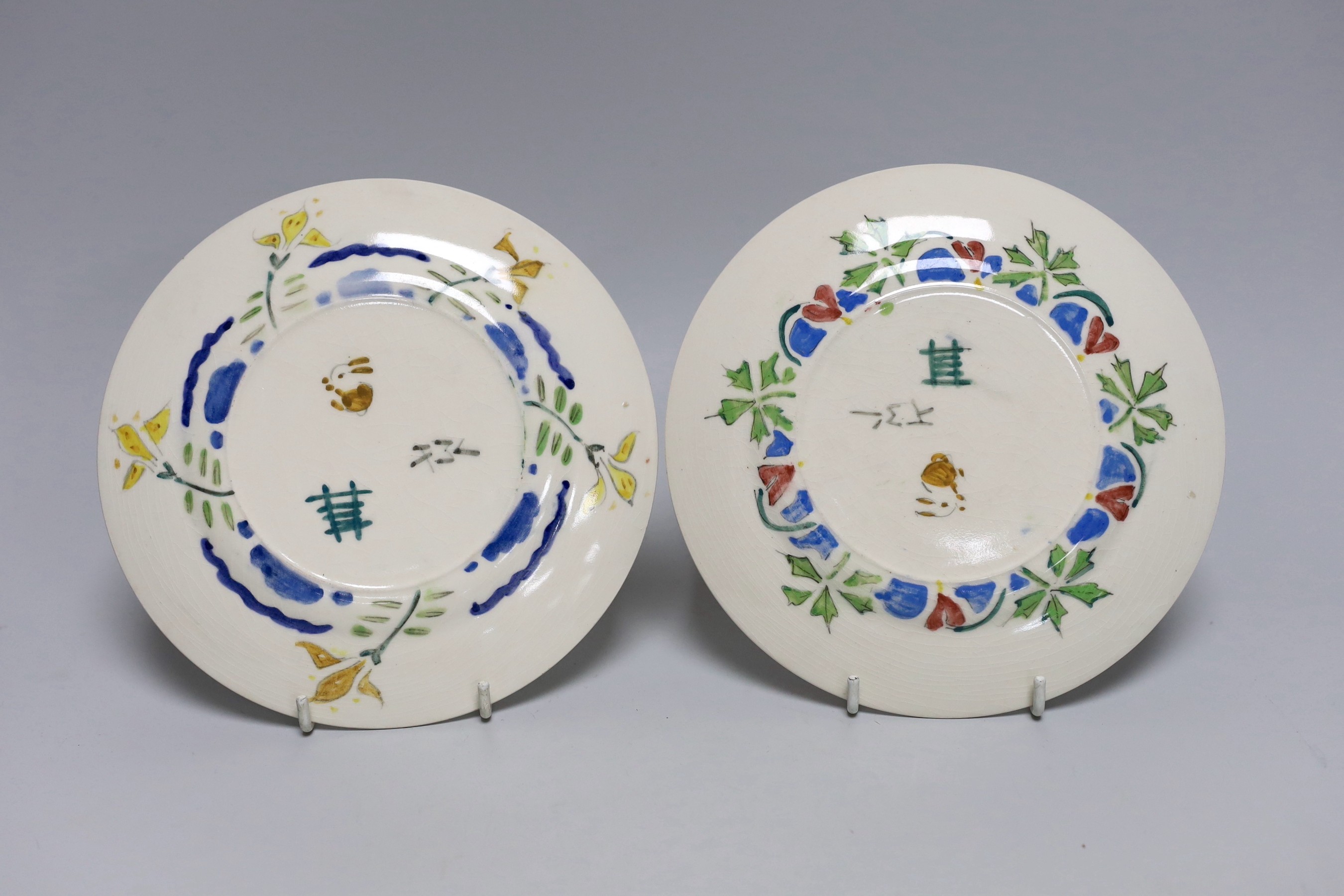 Jessie Marion King (1875-1949), four various floral design tea plates and three tea cups